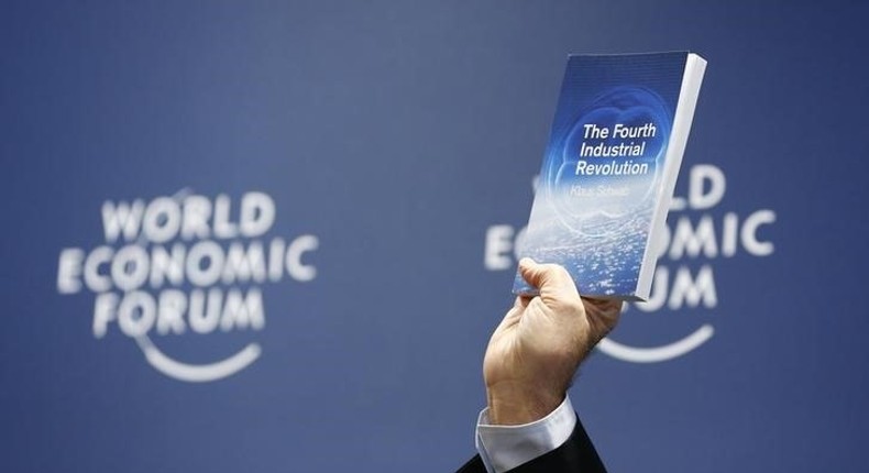 World Economic Forum (WEF) Executive Chairman and founder Klaus Schwab presents his book, 'The Fourth Industrial Revolution', during a news conference in Cologny, near Geneva, January 13, 2016.  REUTERS/Denis Balibouse