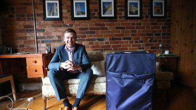 Toronto Star reporter David Bateman poses with his suitcase after his year staying with Airbnb in Toronto.Vince Talotta/Toronto Star via Getty Images