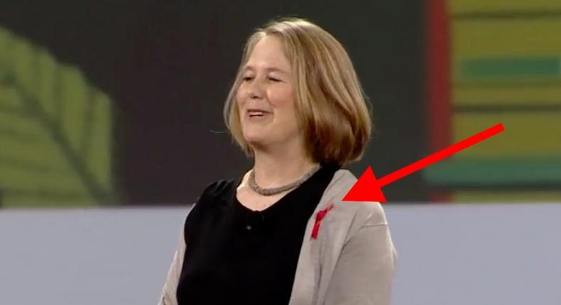 Diane Green wears a red ribbon in support of International Women's Day.