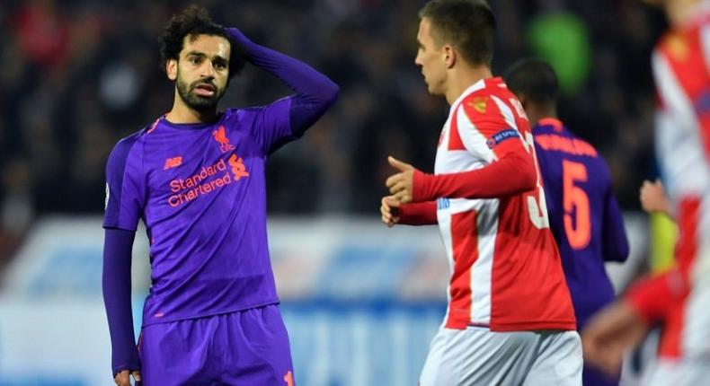 Head-scratcher: Mohamed Salah (left) failed to fire as Liverpool suffered a shock 2-0 defeat to Red Star Belgrade