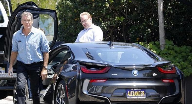 007 star, Pierce Brosnan acepting his newly purchased BMW