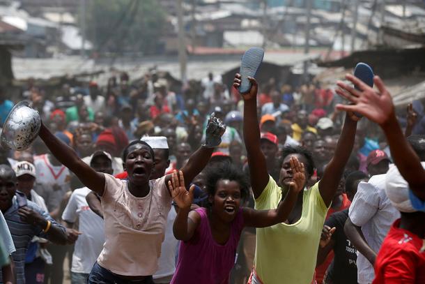 Supporters of an opposition leader Raila Odinga celebrate in Mathare slum after President Uhuru Keny