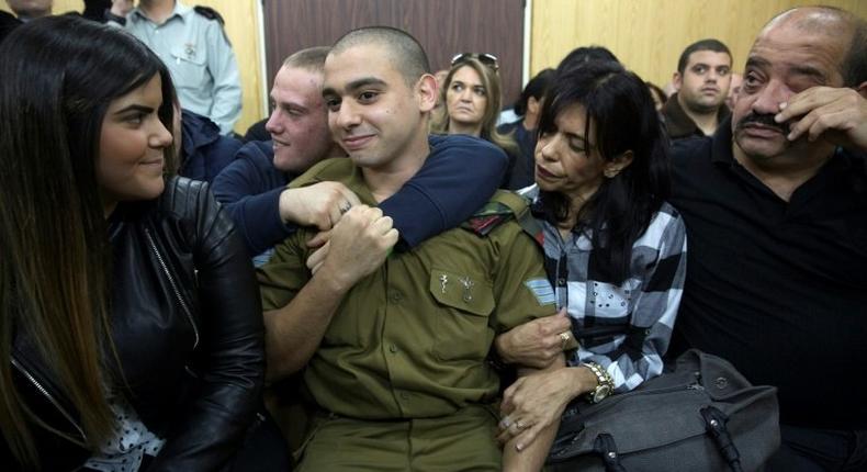 Israeli soldier Elor Azaria (C) had been on trial for manslaughter in a military court, with right-wing politicians defending him despite top army brass harshly condemning the killing