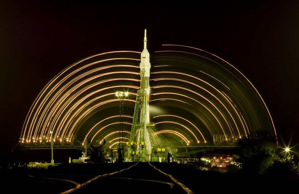 Service towers move away from the Russian Soyuz TMA-01M spacecraft at the Baikonur cosmodrome