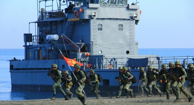 Philippines Marines take part in a beach landing as part of the 11-day Balikatan (shoulder-to-shoulder) annual joint US and Philippine military exercises at San Jose airport in Antique province, central Philippines on April 11, 2016