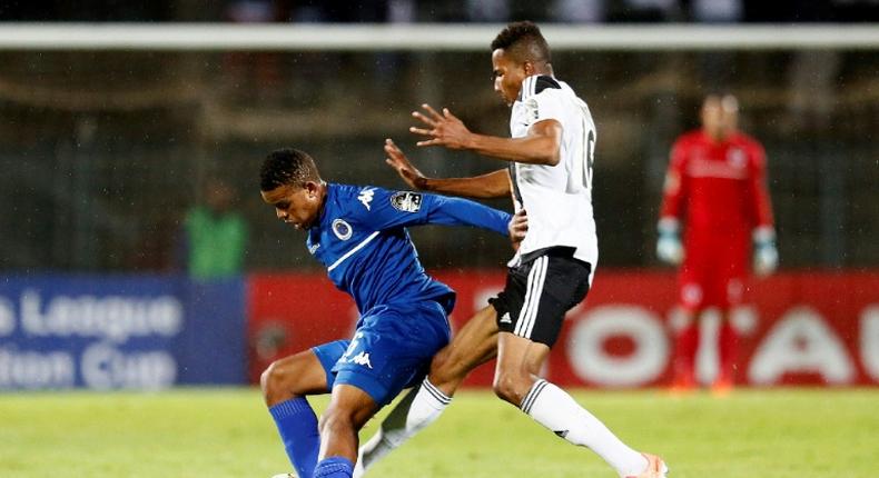 A file photo of SuperSport United midfielder Sipho Mbule (L), who scored the only goal in a South African Premiership match against Bidvest Wits in Johannesburg Friday