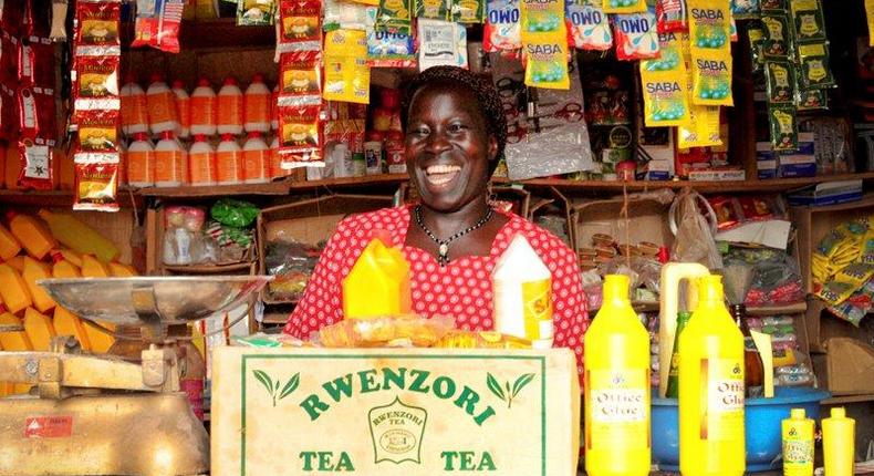 A retailer in her small retailing business in Kampala