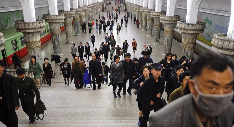 People leave a subway station visited by foreign reporters, in central Pyongyang, North Korea April 14, 2017.