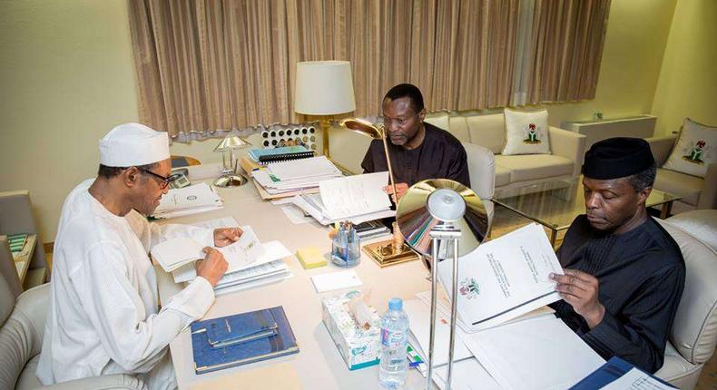 President Muhammadu Buhari (left), Minister of Budget and National Planning, Udoma Udo Udoma (middle), and Yemi Osinbajo (right)