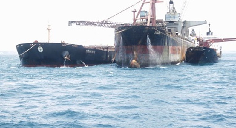 The Ship being loaded with manganese from the shuttle ship (right)