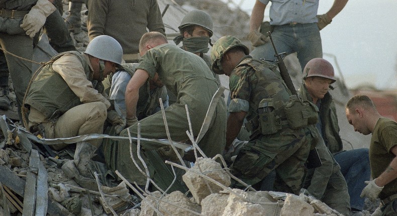 FILE - An Oct. 23, 1983, file photo shows service members digging through rubble after a truck bombing on the US Marine barracks in Beirut, Lebanon.AP Photo/Jim Bourdier, File