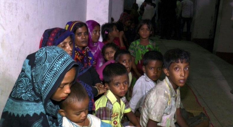 Bangladeshi villagers gather in a cyclone shelter after being evacuated from coastal villages in the Cox's Bazar district as Cyclone Mora approaches the country