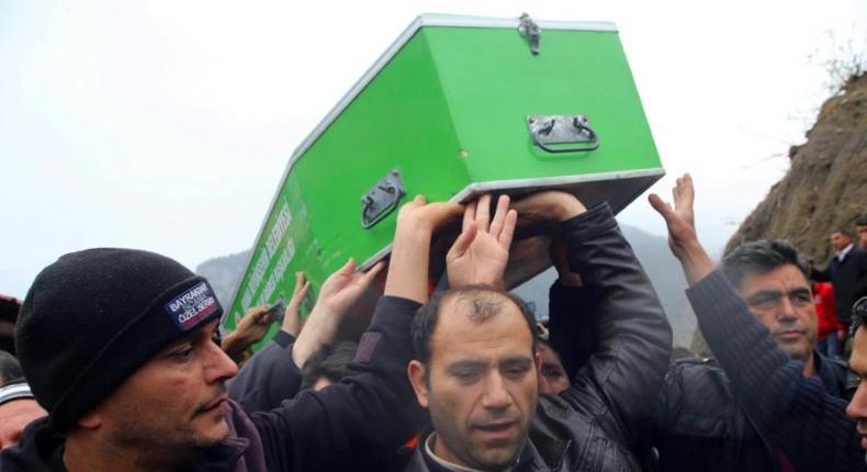 Relatives carry a coffin in Adana, Turkey, on December 1, 2016 during a funeral for the victims of a fire that killed 11 schoolgirls and an adult tutor