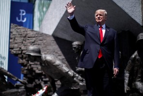 U.S. President Donald Trump waves as he arrives to hold a public speech in front of the Warsaw Upris