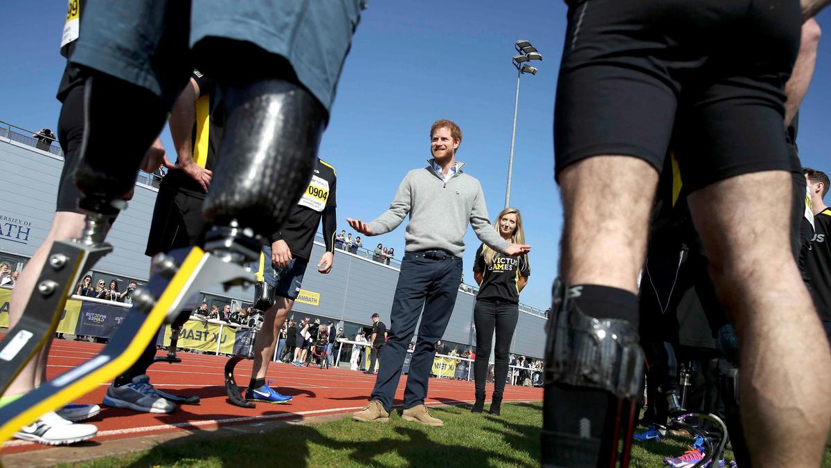 Britain's Prince Harry Patron of the Invictus Games Foundation, speaks to competitors as he attends 