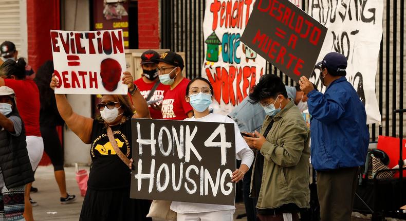 Sophia Garcia, center, with Legacy LA in Boyle Heights joins housing advocates and tenants gathered against eviction of tenants from the 50 unit Tokio Hotel apartments n downtown Los Angeles.
