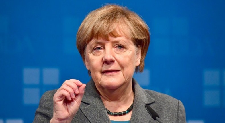 German Chancellor Angela Merkel addresses guests at a meeting of the Confederation of German Employers' Associations in Berlin on November 15, 2016