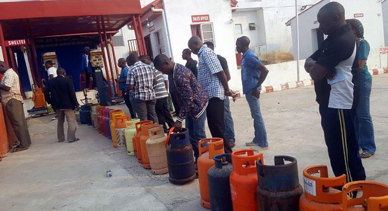 A cooking gas depot with customers queuing up to refill their cylinders. [Punch]
