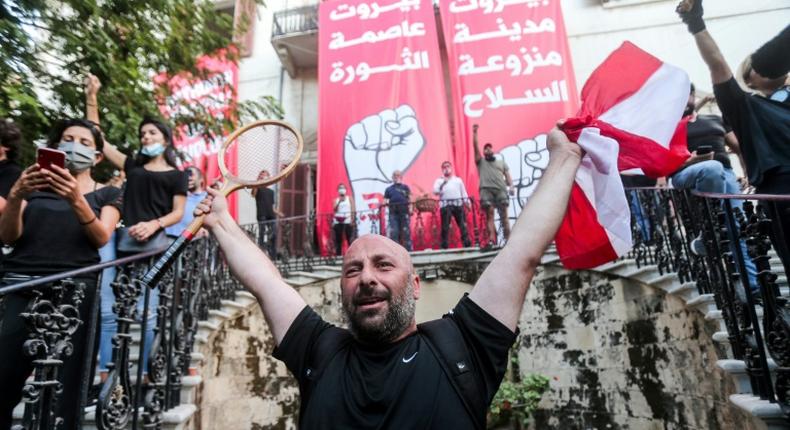 Lebanese protesters celebrate storming the Ministry of Foreign Affairs in Beirut