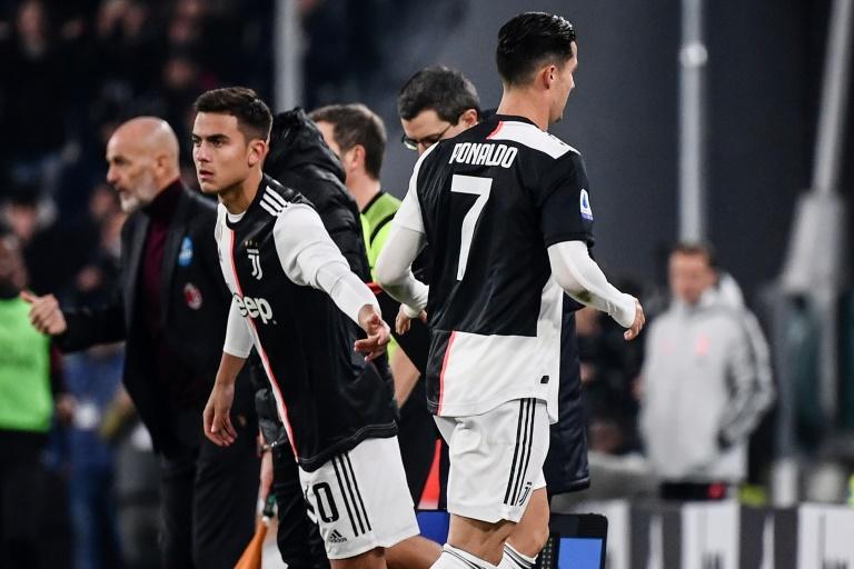 Cristiano Ronaldo (R) was furious after being substituted for Juventus teammate Paulo Dybala (L) against AC Milan on November 10