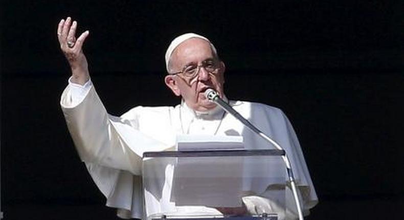 Pope Francis gestures during his Sunday Angelus prayer in Saint Peters square at the Vatican November 1, 2015.