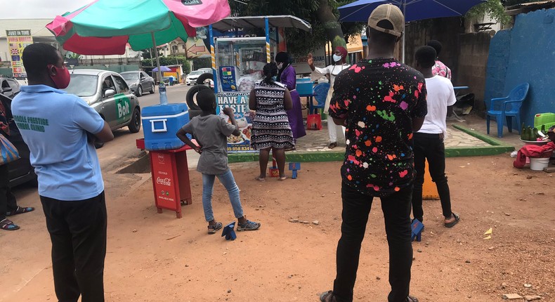 Waakye seller and her customers