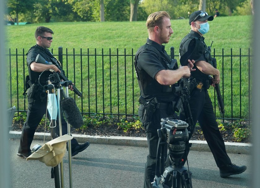 Police officers stop a suspect after a shooting incident outside of the White House, in Washington