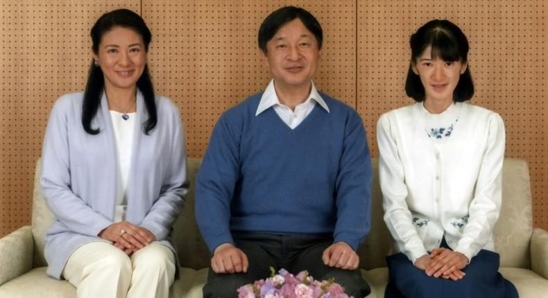 Crown Prince Naruhito (C) poses with Crown Princess Masako (L) and their daughter Princess Aiko at Togu Palace in Tokyo in a photo released on February 22, 2017 by the Imperial Household Agency of Japan