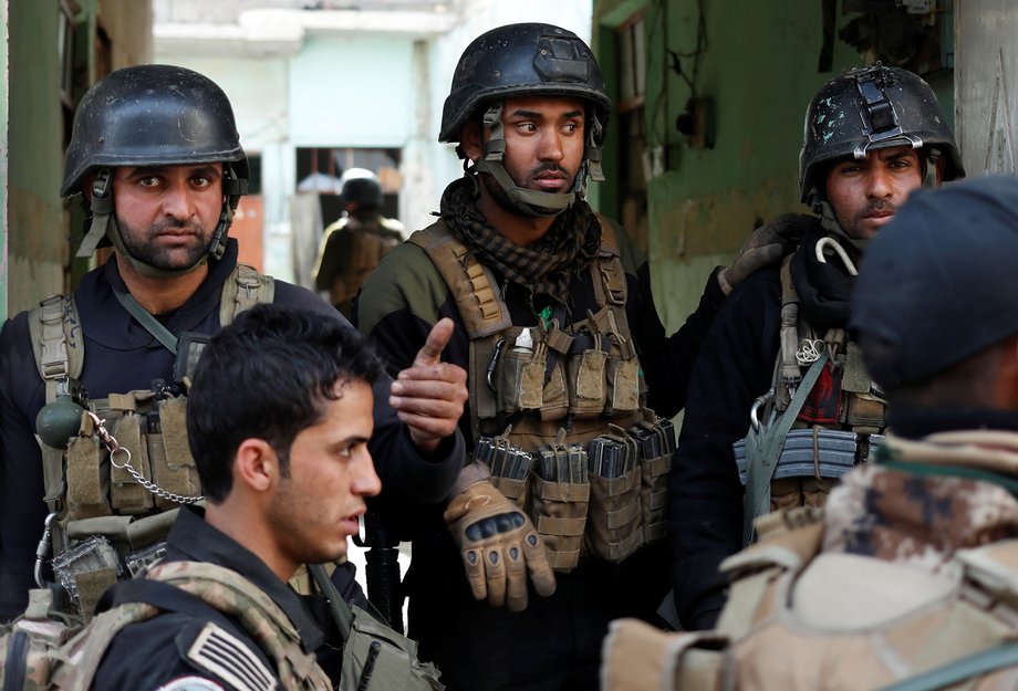 Iraqi special-forces soldiers stand in a house during a battle with ISIS militants in Mosul, Iraq, March 1, 2017.