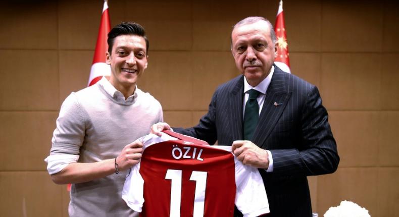 This photograph of Mesut Ozil meeting Turkish President Recep Tayyip Erdogan in May 2018 sparked a storm of criticism in Germany