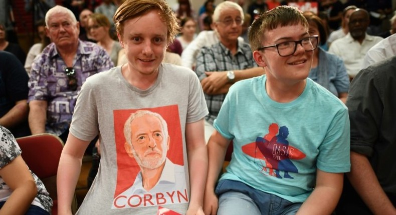 A young Labour Party supporter shows off his T-shirt with the face of Jeremy Corbyn at an election rally in Basildon