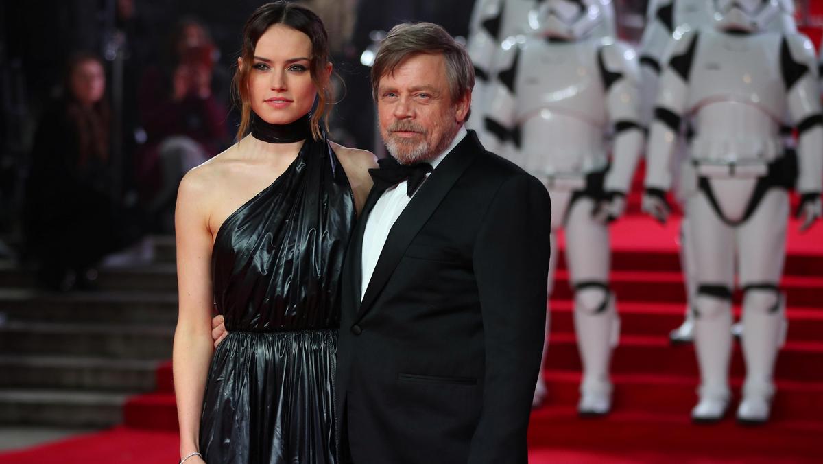 Actors Daisy Ridley and Mark Hamill pose for photographers as they arrive for the European Premiere of 'Star Wars: The Last Jedi', at the Royal Albert Hall in central London