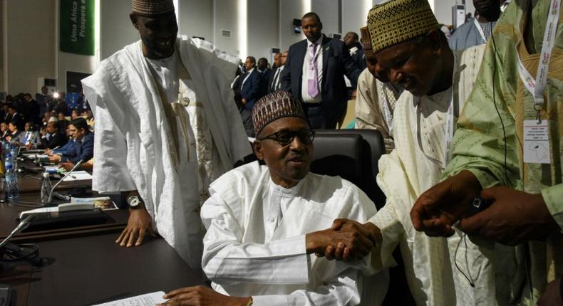 Nigerian President Muhammadu Buhari signs onto the landmark African trade deal at the AU summit in Niamey