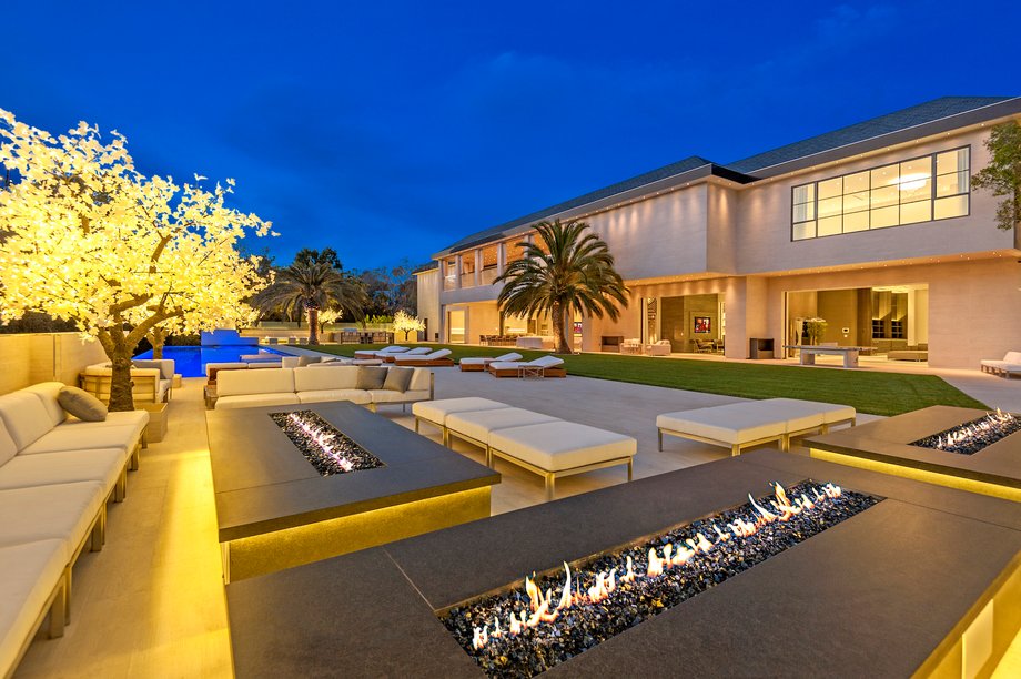 The pool deck has several fire pits and plenty of space for lounging.