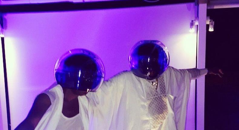 David Tlale and D'Banj adorning Daft Punk helmets on white attires