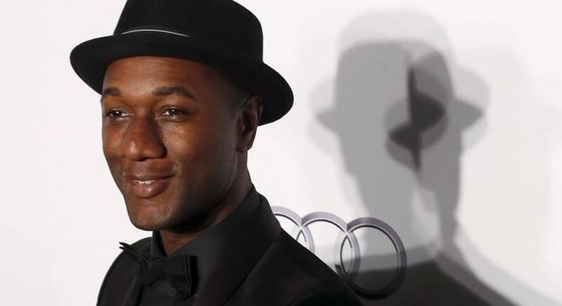 U.S. musician Aloe Blacc poses upon arrival at the Foundation for AIDS Research (amfAR) fundraising gala in Hong Kong, China March 19, 2016. 