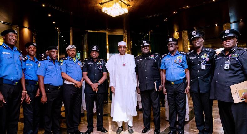President Buhari and officers of the Nigerian Police Force, including the Inspector General of Police, Ibrahim Idris