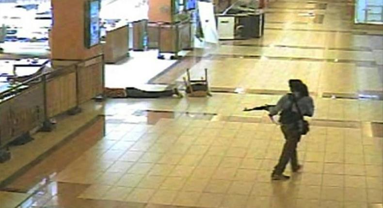 An armed man walks during an attack on the Westgate mall in Nairobi in September 2013