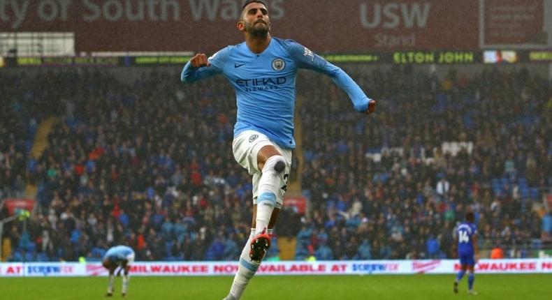 Manchester City's Riyad Mahrez celebrates after scoring his second goal at Cardiff