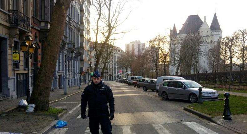 A police officer stands guard in Porte de Hal, Brussels, after a driver was arrested with gas cylinders in his vehicle on March 2, 2017