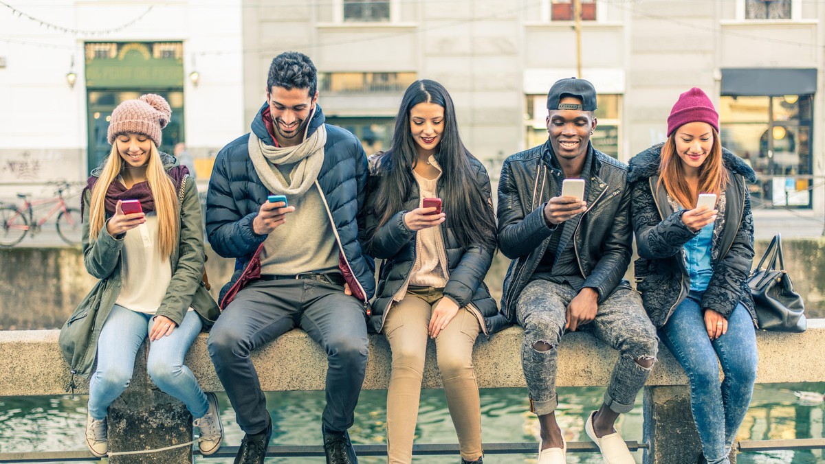 Multiracial group of people with cellphones