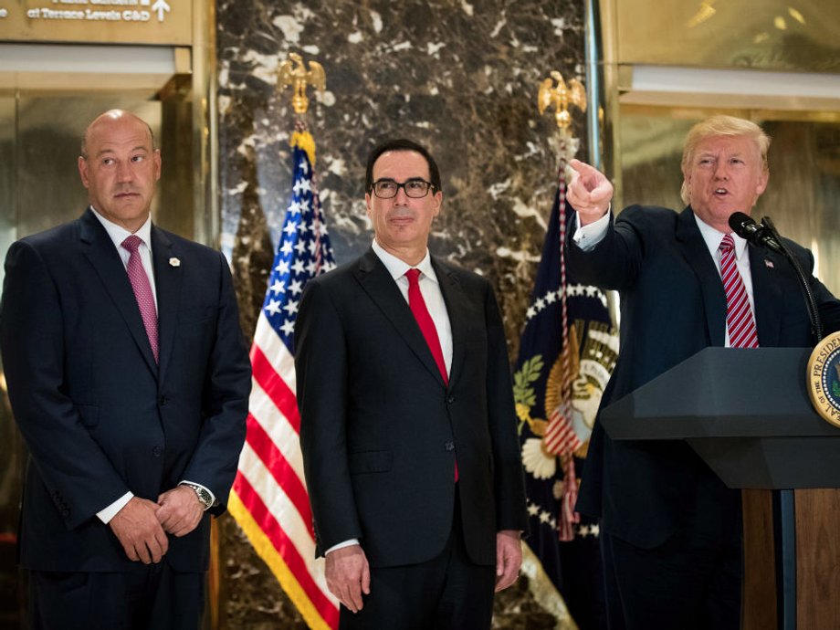 Gary Cohn, Steven Mnuchin, and Donald Trump.