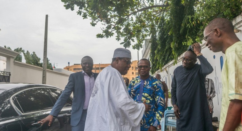 Benin's former leader Thomas Boni Yayi (in white) 2nd L, white)after arriving in in Cotonou on Wednesday