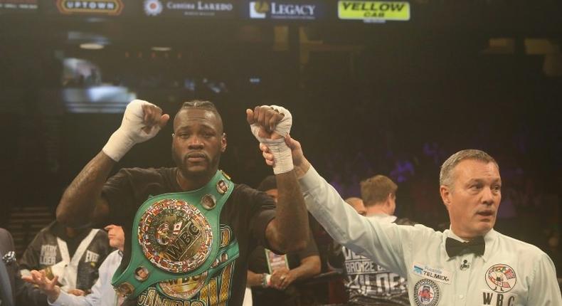 Deontay Wilder started poorly in front of hometown fans, but sprang to life in the fifth round, knocking Gerald Washington down to retain his WBC heavyweight title