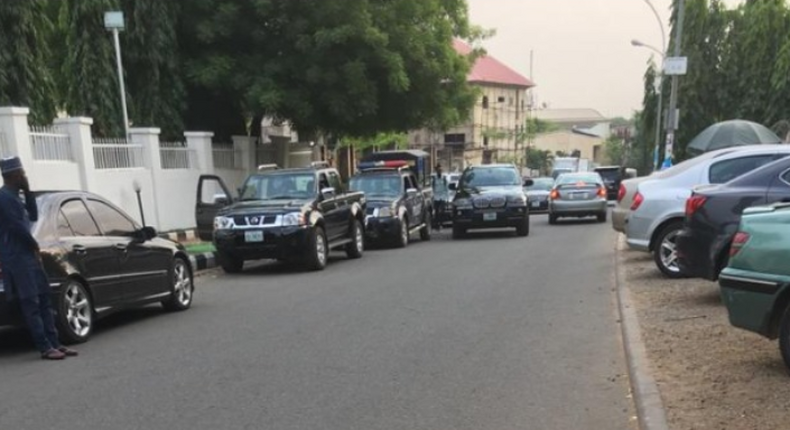 Police patrol vans at APC secretariat in Abuja on Wednesday after Adams Oshiomhole's suspension. (Punch)