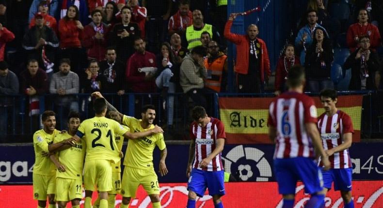 Villarreal's players celebrate after midfielder Roberto Soriano scored during the Spanish league football match against Atletico Madrid April 25, 2017