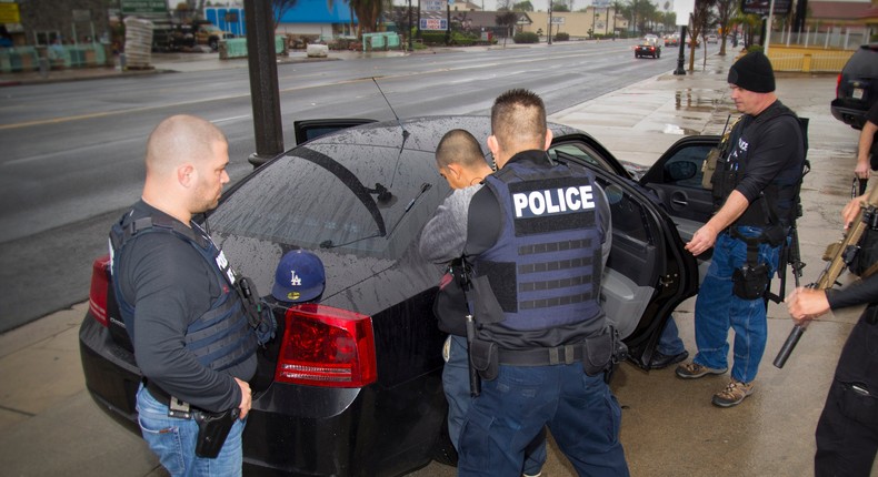 Immigration and Customs Enforcement (ICE) agents make an arrest during a targeted enforcement operation in Los Angeles, California.