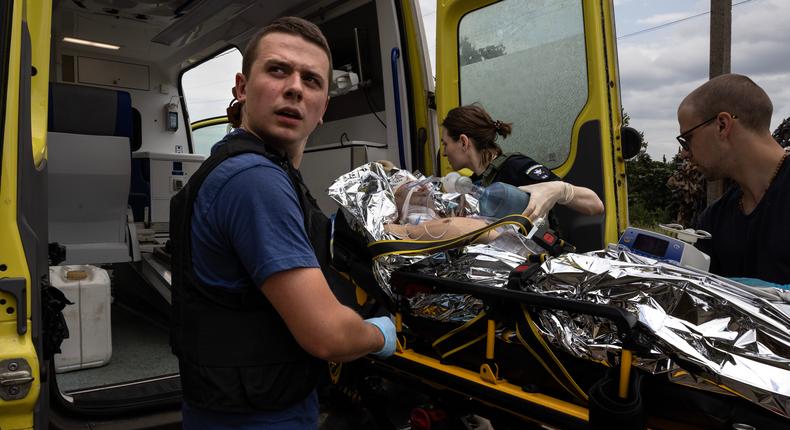 An ambulance worker transfers a seriously wounded soldier after being treated in Donetsk, Ukraine.Paula Bronstein/Getty Images