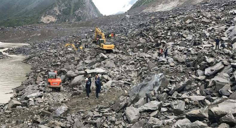 A couple and a baby were rescued and taken to hospital after 46 homes in the Chinese village of Xinmo were swallowed when the side of a mountain collapsed