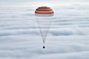 Soyuz capsule carrying International Space Station crew members descends near Dzhezkazgan